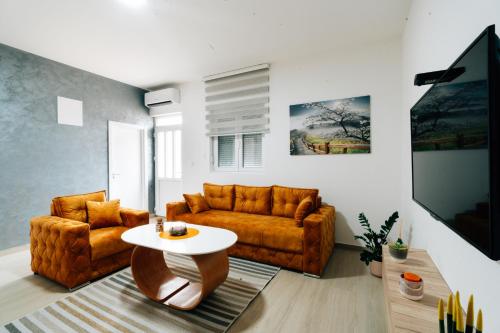 a living room with a couch and a table at Grahovo Lake in Čelina