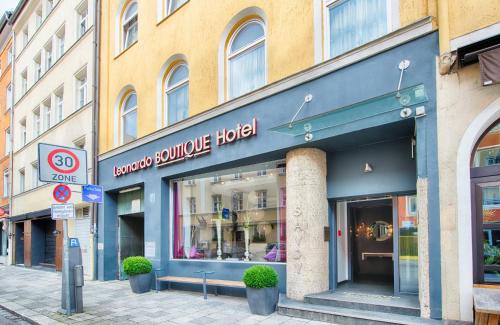 a store front of a building on a street at Leonardo Boutique Hotel Munich in Munich
