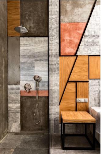 a bathroom with a shower and a wooden table at Lena Apartments Potos Thassos in Potos