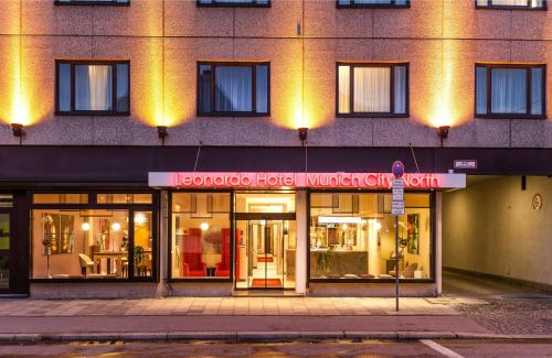 a store front of a building with a sign on it at Leonardo Hotel Munich City North in Munich