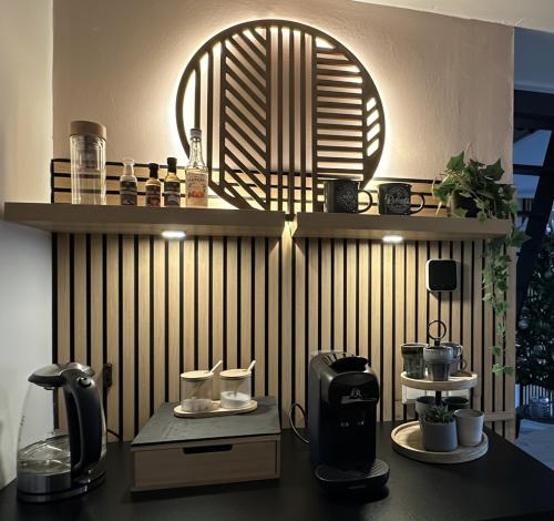 a counter with a coffee maker on top of it at Luxe Vakantiehuis met privé Wellness in Zuidwolde