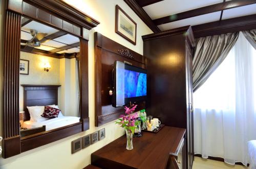 TV a/nebo společenská místnost v ubytování Hotel Kooler Inn