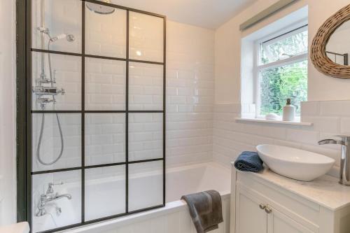 a bathroom with a shower and a sink at 2 Bed in Fowey oc-m29077 in Fowey