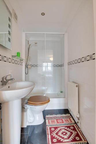 a bathroom with a toilet and a sink and a shower at 2 Bed in Broadstairs oc-th013 in Broadstairs