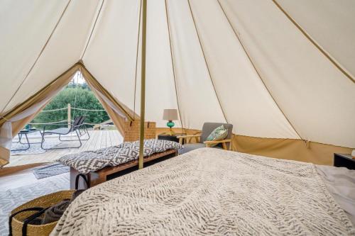 a room with a tent with two beds and a table at 1 Bed in Austwick oc-r32793 in Eldroth