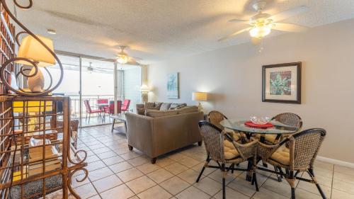 a living room with a table and chairs and a couch at Brisa Del Mar by AvantStay Communal Pool Gated Community Ocean Front in Key West