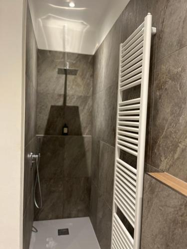 a bathroom with a shower with a walk in shower at Green Woods in Verona