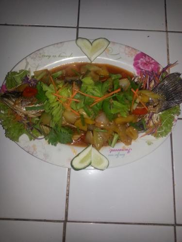 a plate of food with a bowl of soup at Happy Days Resort in Ko Mak