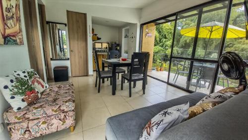 a living room with a couch and a table at Apartamento turistico diana in La Tebaida