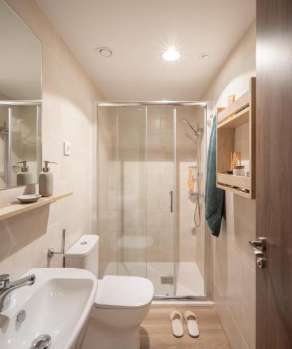 a bathroom with a shower and a toilet and a sink at Stephouse Girona Tarradellas in Girona