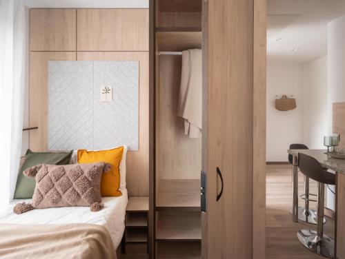 a bedroom with a bed and a sliding glass door at Stephouse Girona Tarradellas in Girona