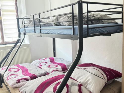 a bunk bed with a pillow on the bottom bunk at Aaron27 in Meißen