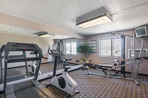 a fitness room with a treadmill and a gym at Motel 6-Marshalltown, IA in Marshalltown