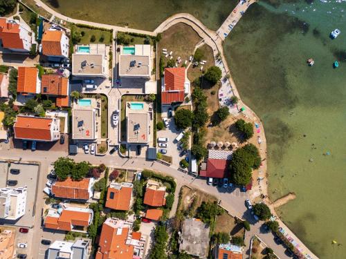 an overhead view of a suburb with houses at Villa Privlaka Travertino in Privlaka