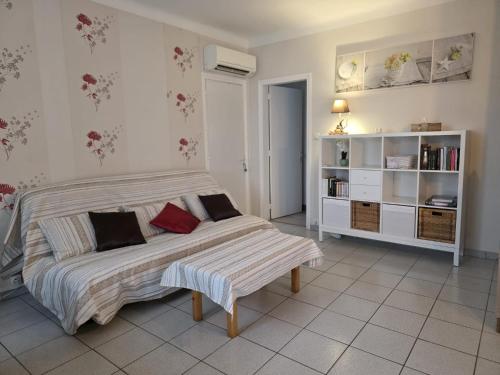 a bedroom with a bed and a book shelf at La Grillotte in Vieux-Boucau-les-Bains