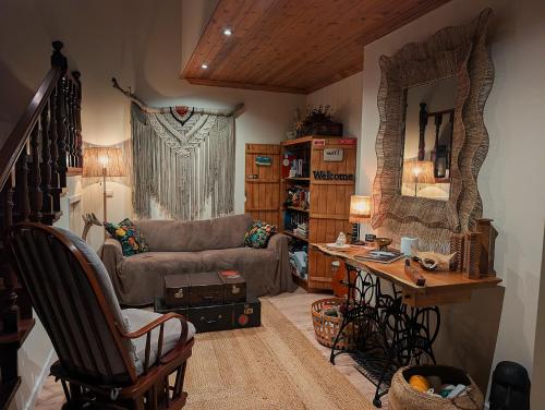a living room with a couch and a table at RiaEncontros- Villa T4 junto Ria e Pinhal in Aveiro