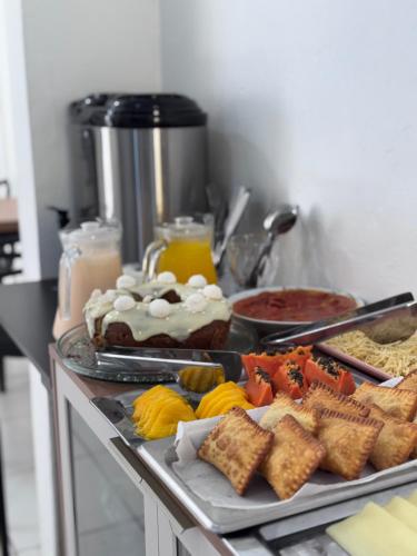 a buffet with many different types of food on a table at Hotel Tropical in Torres