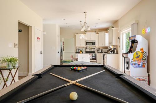 a living room with a pool table and a kitchen at Perfect Family Getaway! Steps from Attractions in Hummelstown