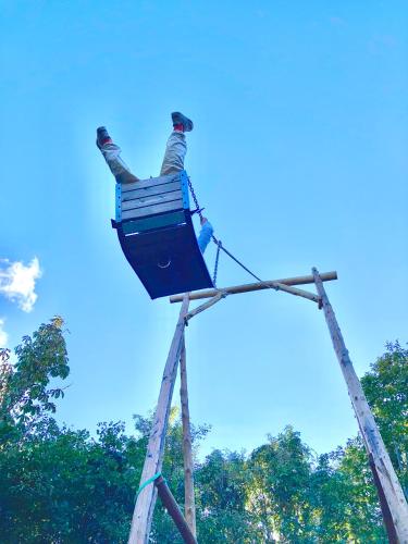 a person standing on top of a ladder at Minanonno Play Village in Yoichi