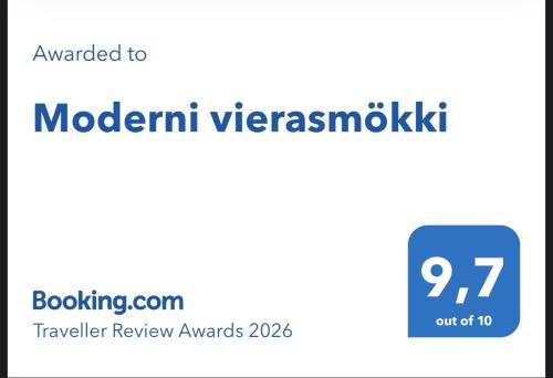 a sign that reads modern vysskwk with a blue rectangle at Moderni vierasmökki in Mikkeli