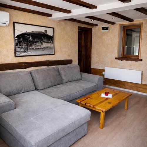 a living room with a couch and a coffee table at Complex Ristanite in Elena