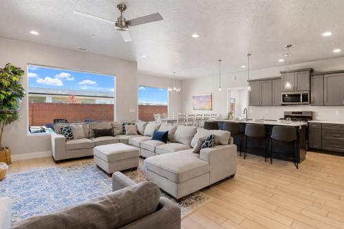 a large living room with couches and a kitchen at Zion Adventure townhouse in Hurricane
