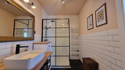 a bathroom with a white sink and a mirror at Mediterranean House - Forest Marjan in Split