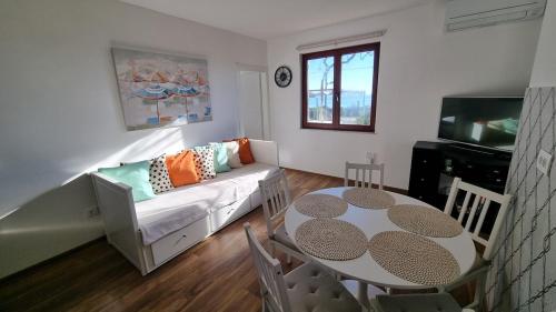 a living room with a couch and a table at Mediterranean House - Forest Marjan in Split