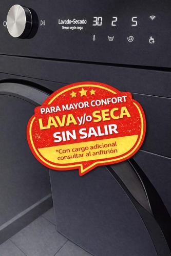 a sign on a washing machine in a kitchen at Cerca al centro, piscinas & jacuzzis y muy dotado in Villeta