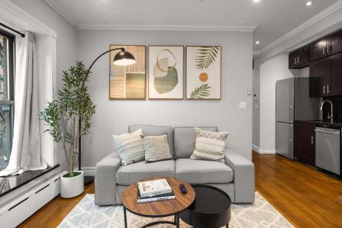 a living room with a couch and a table at Sleek Lower East Side Retreat in New York