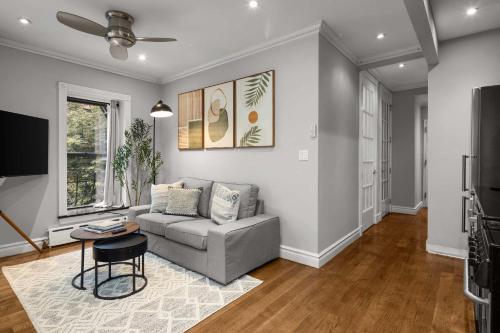 a living room with a couch and a table at Sleek Lower East Side Retreat in New York