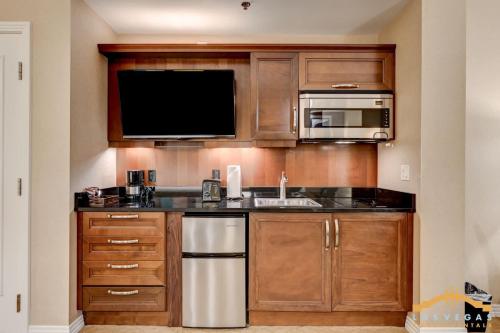 a kitchen with a sink and a microwave at MGM Signature 34-818 Jacuzzi Studio Upper Penthouse in Las Vegas
