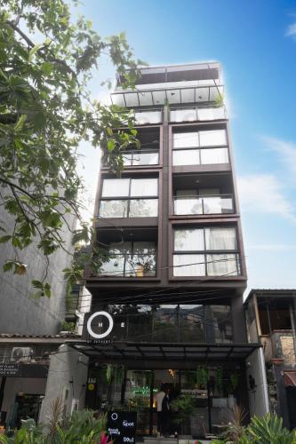 a tall building with a lot of windows at The O by Seekers Medellín in Medellín