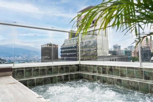 a hot tub on the roof of a building at The O by Seekers Medellín in Medellín