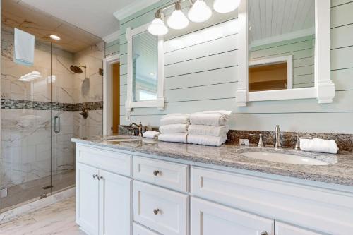 a bathroom with a sink and a shower at HB303 My Flippin' House in Holden Beach
