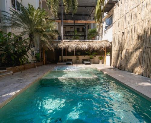 a swimming pool in the middle of a building at Ashly Boulevard in Acapulco