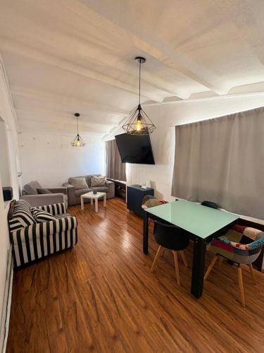 a living room with a couch and a table at Soul Home in Momoxpan