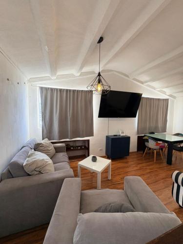 a living room with a couch and a table at Soul Home in Momoxpan