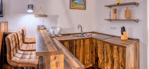 a kitchen with a wooden counter top and a sink at Seaside-Townhouse in Timmendorfer Strand