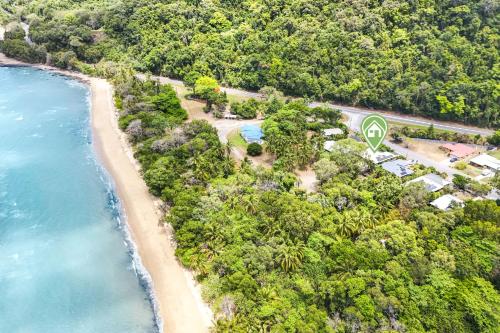 an aerial view of a beach with a resort at Beachfront Serenity Family Home at Wonga Beach in Wonga