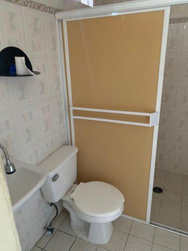 a bathroom with a white toilet and a sink at Private apartment La Paz baja in La Paz