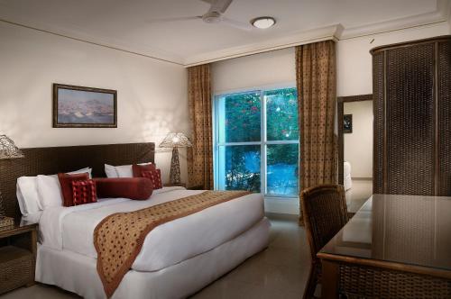 Säng eller sängar i ett rum på Al Nahda Resort & Spa