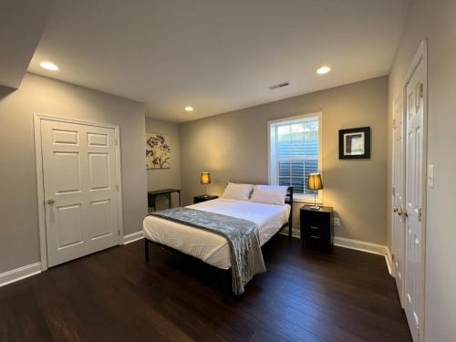 a bedroom with a bed and a window at 25 Lux Room 6 - 1 Queen Bed, Shared Bathroom - Nonsmoking in Arlington