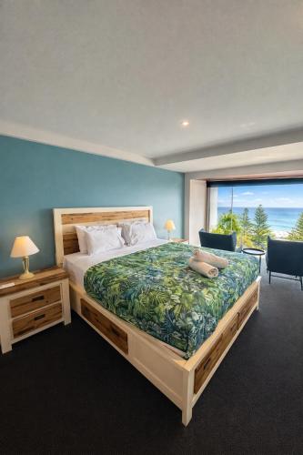 a bedroom with a large bed and a large window at Ocean View-breath Taking Views, Amazing Facilities in Perth