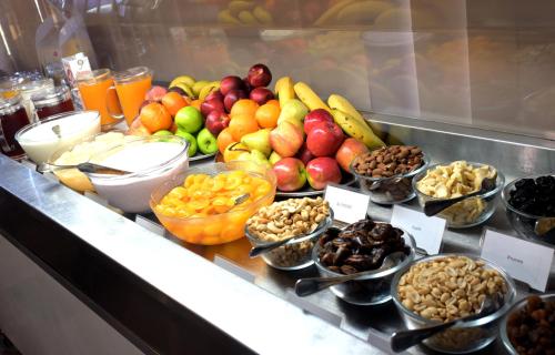 a buffet filled with different types of fruits and vegetables at Manjimup Motor Inn in Manjimup