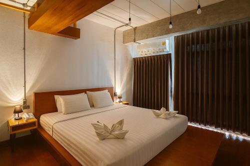 Llit o llits en una habitació de The Loft Room Nimman