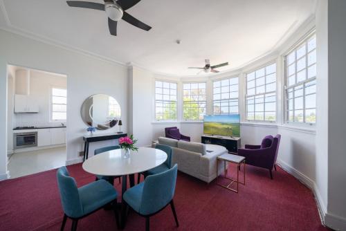 a living room with a table and chairs at The Hallows Accommodation in Bathurst