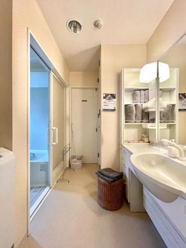 a bathroom with a sink and a toilet in it at YUKARA-YA YA - Vacation STAY 18011 in Ōnuma