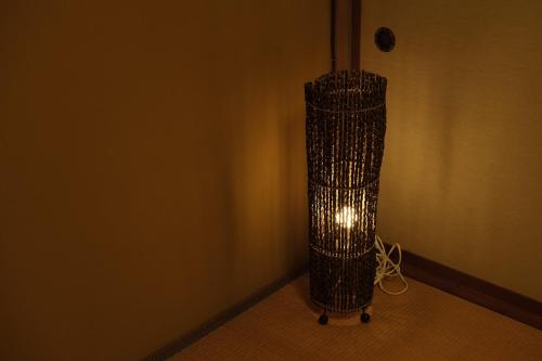 a light in a corner of a room at Etchu Yatsuo Base OYATSU in Toyama