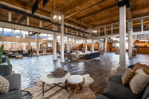 a lobby with couches and tables in a building at Hyatt Place Fort Worth Stockyard in Fort Worth